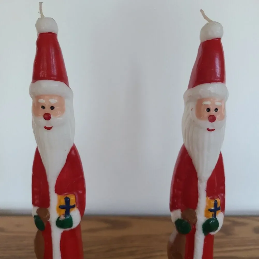 Two Vintage Santa Claus Character Candles In Christmas Ornament Candle Holders